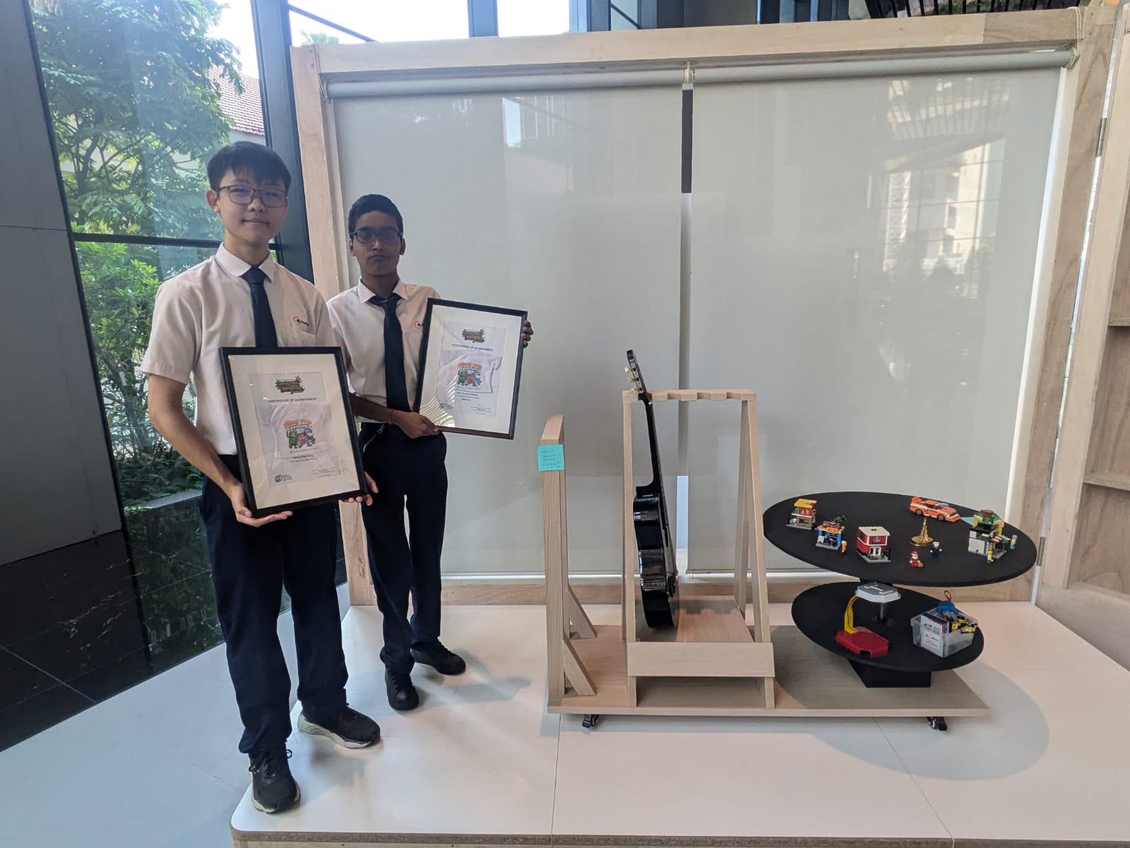 Chong Haw Yang (left) received Certificate of Participation, while Siva Ganesh Raman (right) won 3rd Prize in the Bulky to Waste Competition 2024